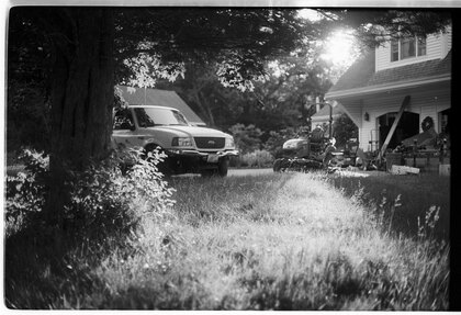 Truck and junk in the yard